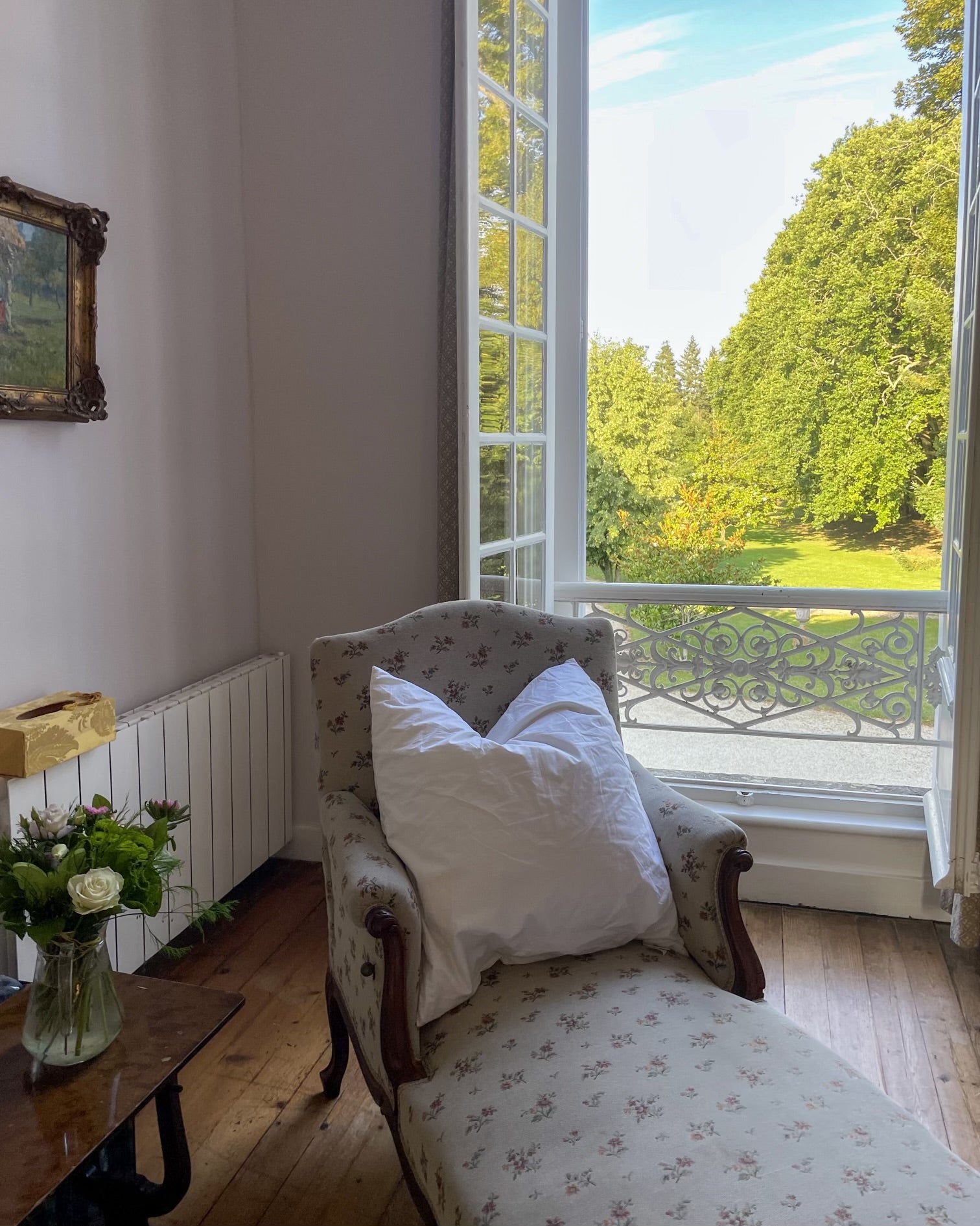 chaise in front of open window