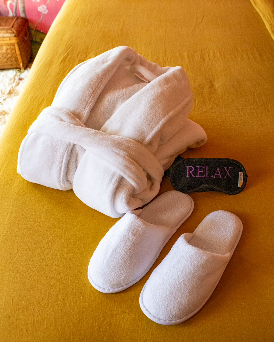 robe, slippers, and eye mask