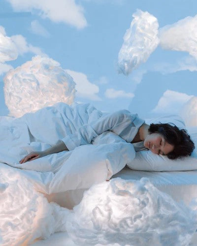woman sleeping on cloud