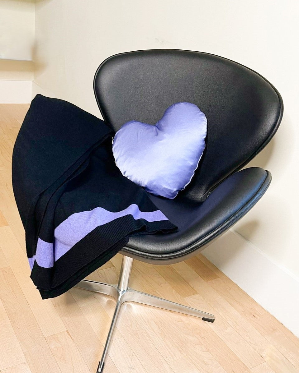 periwinkle heart pillow in chair