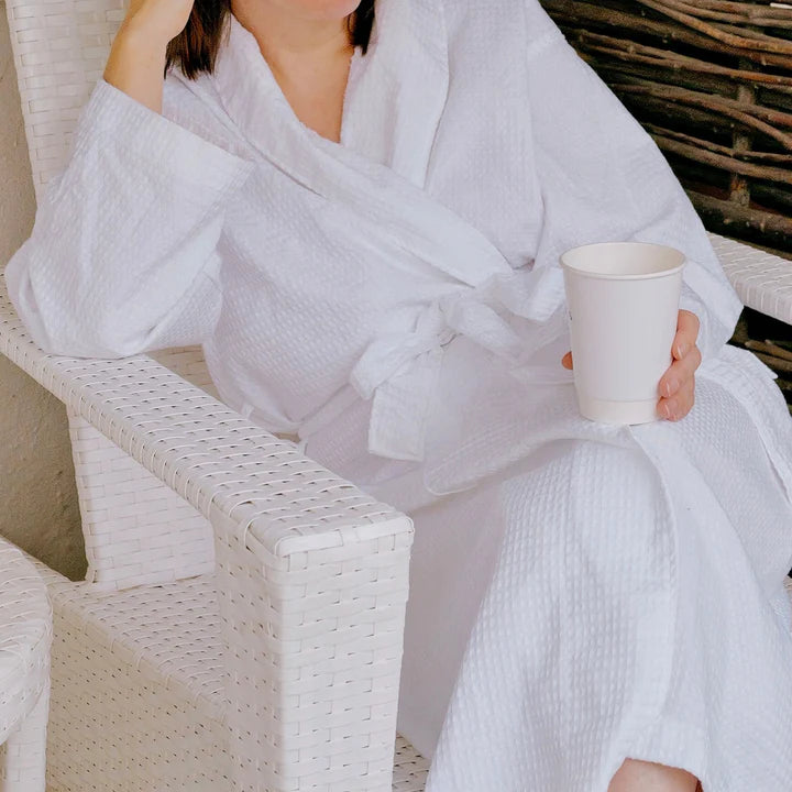 woman sitting wearing white robe