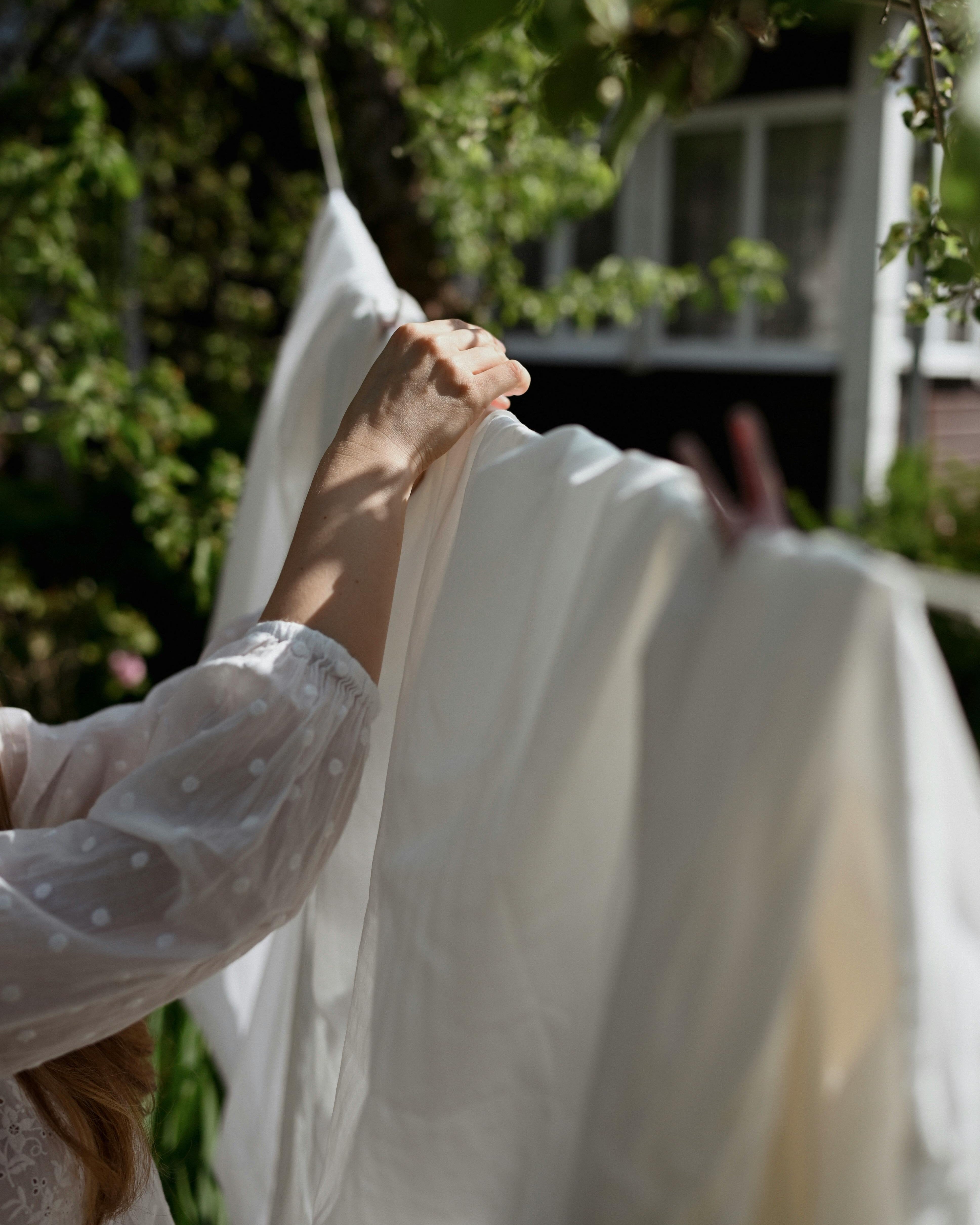 hanging sheet on clothesline