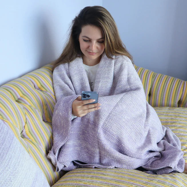 purple knitted throw and throw pillow set