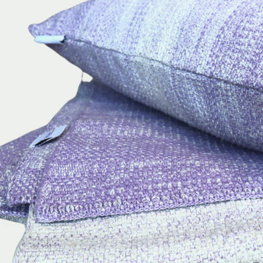 purple knitted throw and throw pillow set